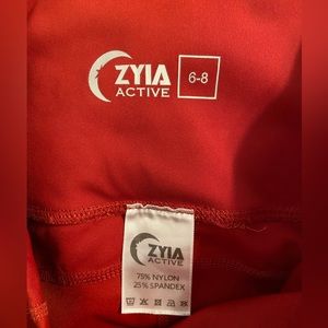 Zyia -size 6-8, deep red capri with side pockets and medium compression
